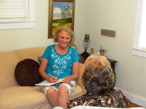 Two ladies sitting down for a counseling session